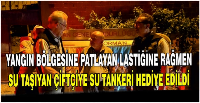 Yangın bölgesine patlayan lastiğine rağmen su taşıyan çiftçiye su tankeri hediye edildi